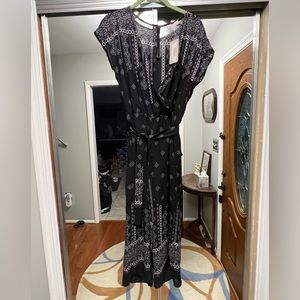 Brand new Women’s Como Vintage romper with tags. Size is small petite.